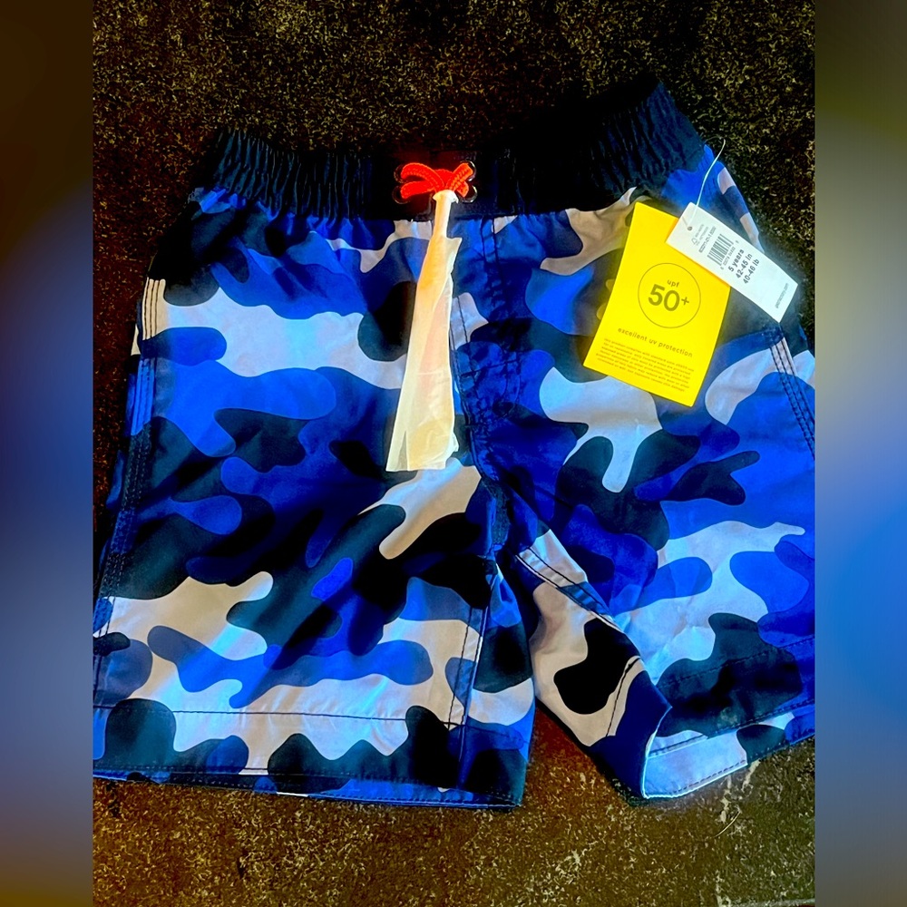 Brand new with tags. GAP camo swim trunks. Size 5